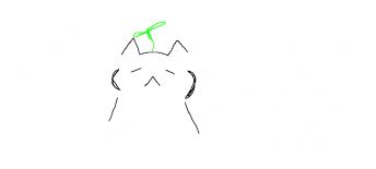 Cute kitten with a small green leaf on its head 