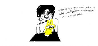 A person wearing glasses is holding up a yellow rabbit 
