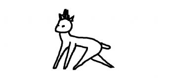 A small animal with horns on its head is walking 