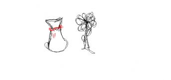 A small pouch tied with a red string and a flower 