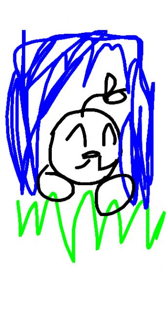 A smiling baby amidst green grass and blue foliage 